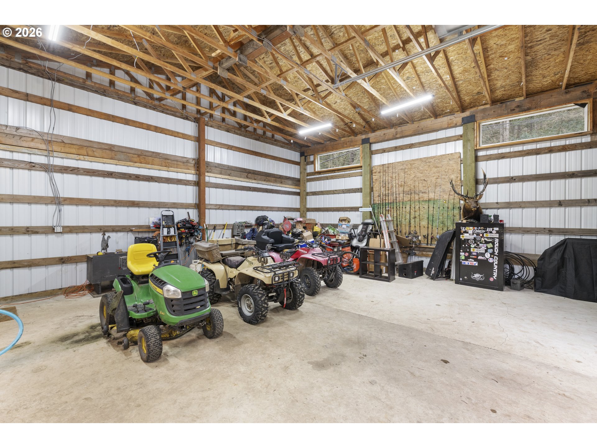 16453 Forsythe Road Oregon City, OR 97045 - Photo 37 of 48 a view of a garage with a table and chairs