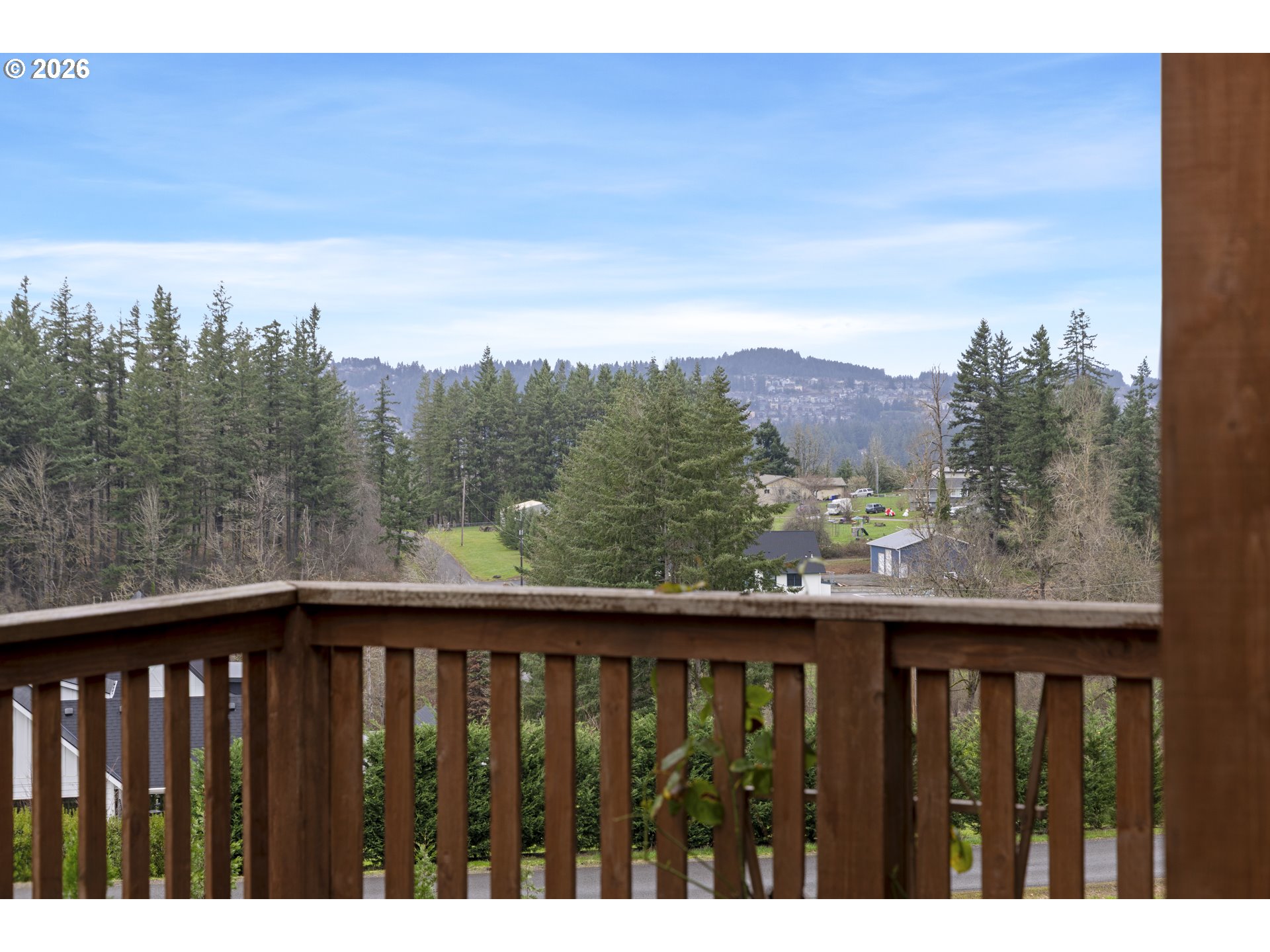 16453 Forsythe Road Oregon City, OR 97045 - Photo 40 of 48 a view of a balcony with wooden fence and floor
