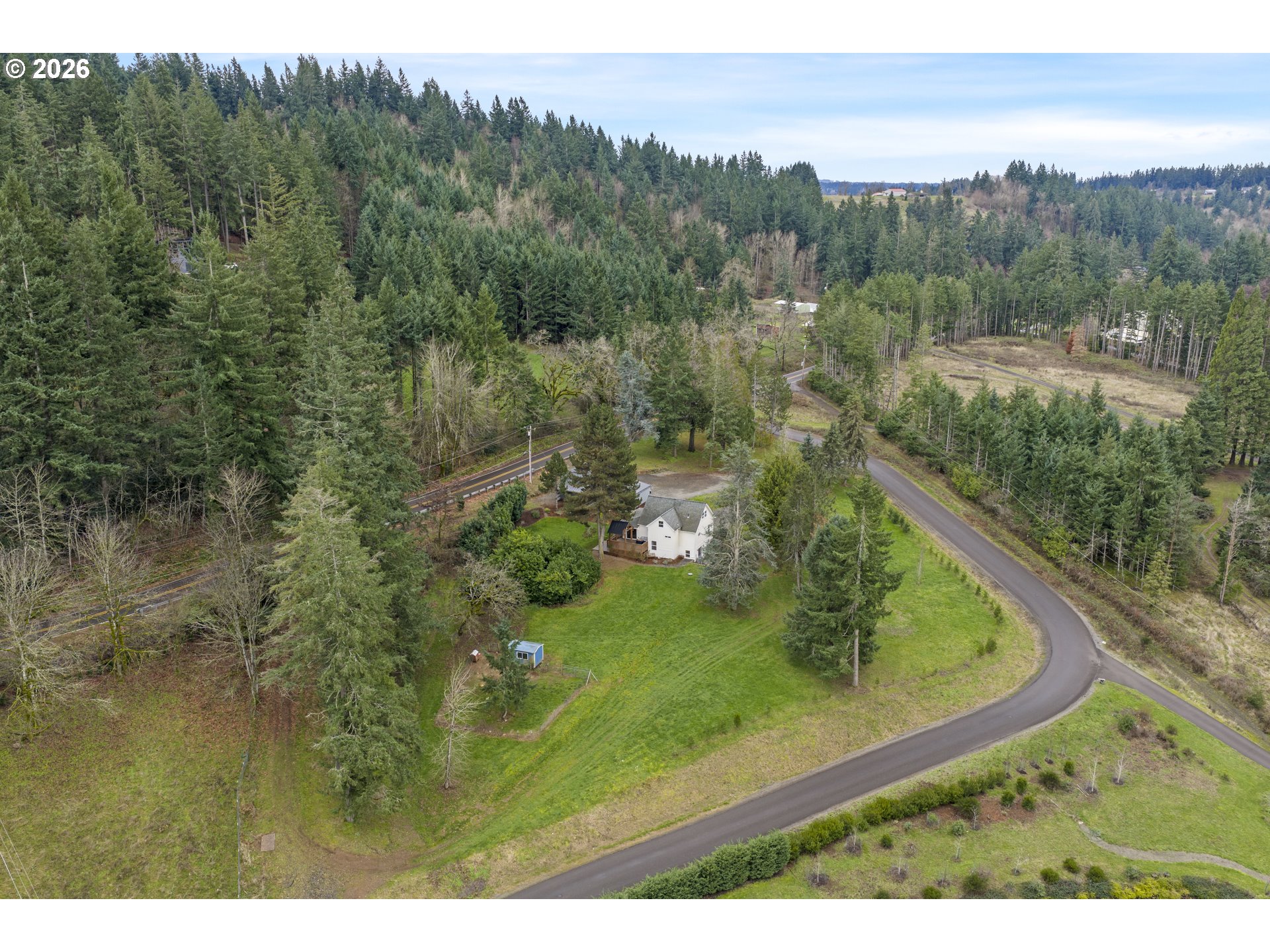 16453 Forsythe Road Oregon City, OR 97045 - Photo 43 of 48 a view of a forest with a lake