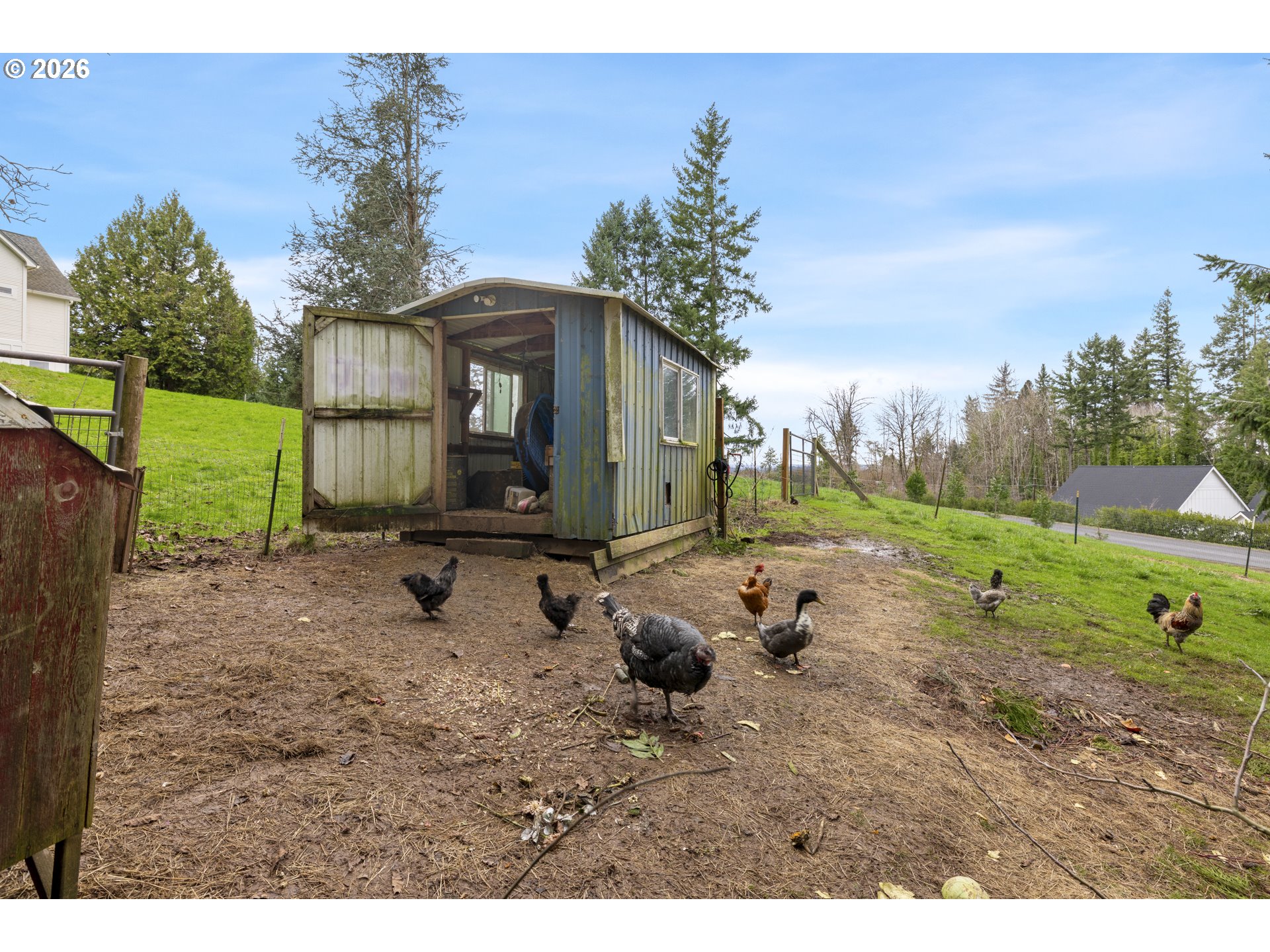 16453 Forsythe Road Oregon City, OR 97045 - Photo 47 of 48 a backyard of a house with barbeque oven table and chairs