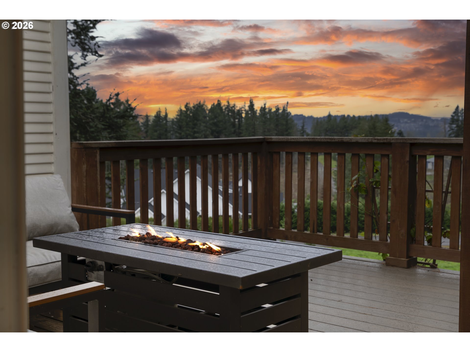 16453 Forsythe Road Oregon City, OR 97045 - Photo 6 of 48 a balcony with a table and chairs