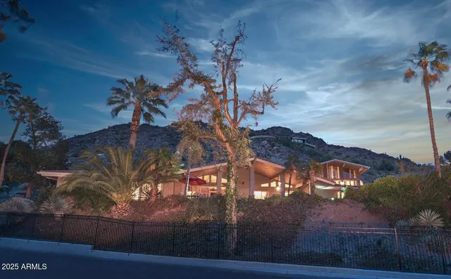 a view of a street with a building in the background