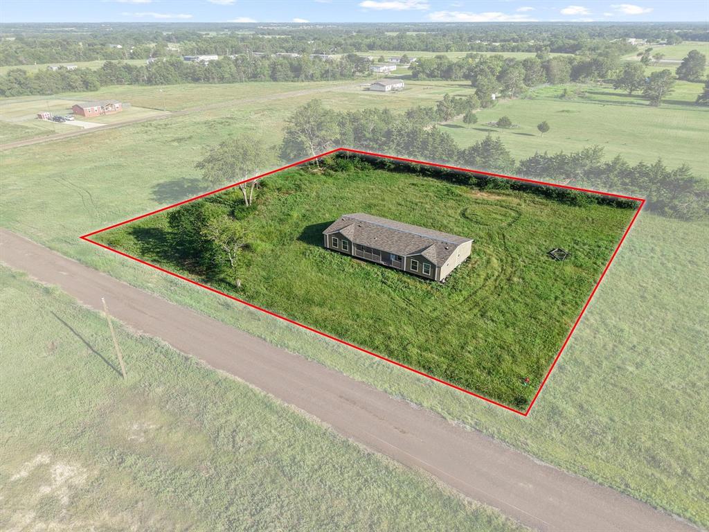 372 Hemby Way Bonham, TX 75418 - Photo 2 of 12 a view of a swimming pool with a lake view