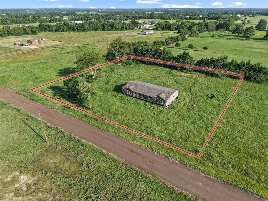 372 Hemby Way Bonham, TX 75418 - Photo 3 of 12 a view of a garden from a balcony