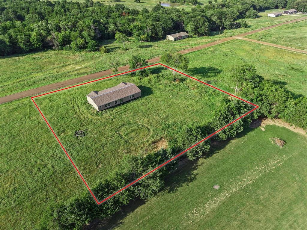 372 Hemby Way Bonham, TX 75418 - Photo 8 of 12 a view of a garden with an outdoor space
