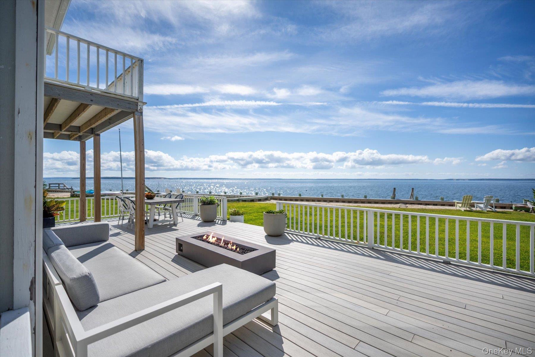 4415 Camp Mineola Road Mattituck, NY 11952 - Photo 1 of 44 Expansive deck ideal for al fresco dining, gatherings and waterfront entertaining.