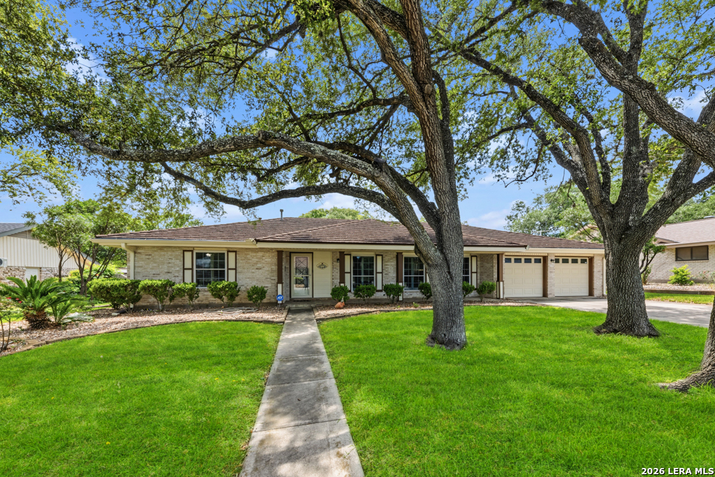 6022 Winding Ridge Drive Windcrest, TX 78239 - Photo 2 of 31 a front view of a house with yard and green space