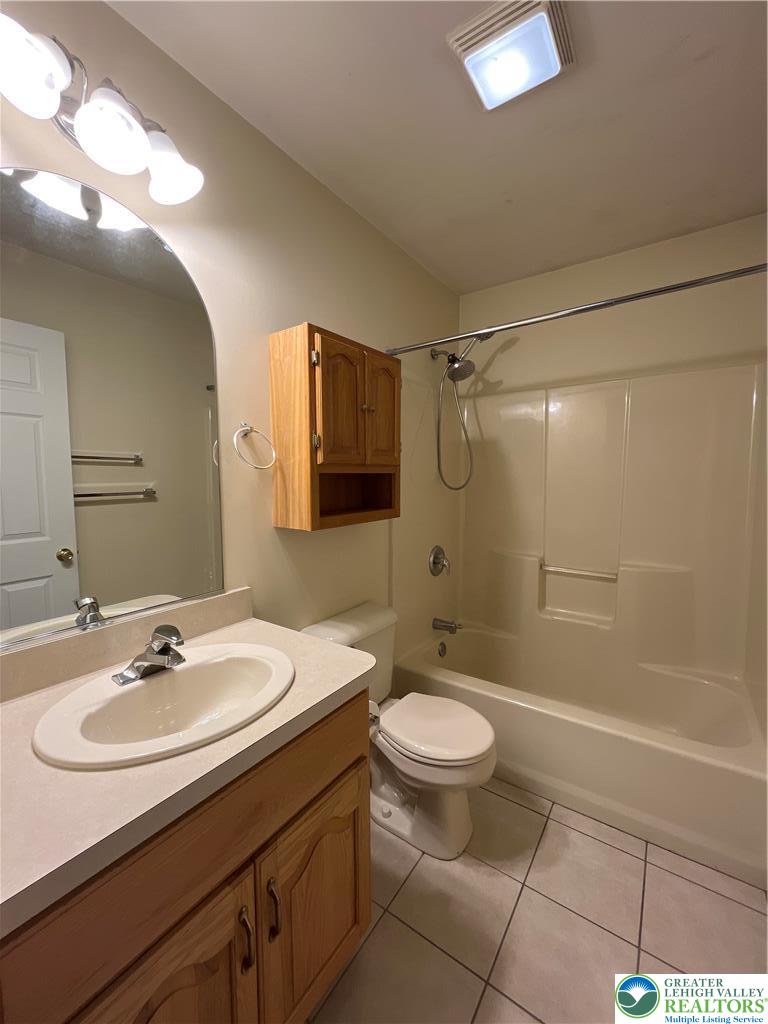 11 South Main Street, Unit 105 Nazareth, PA 18064 - Photo 7 of 10 a bathroom with a sink toilet a mirror and shower