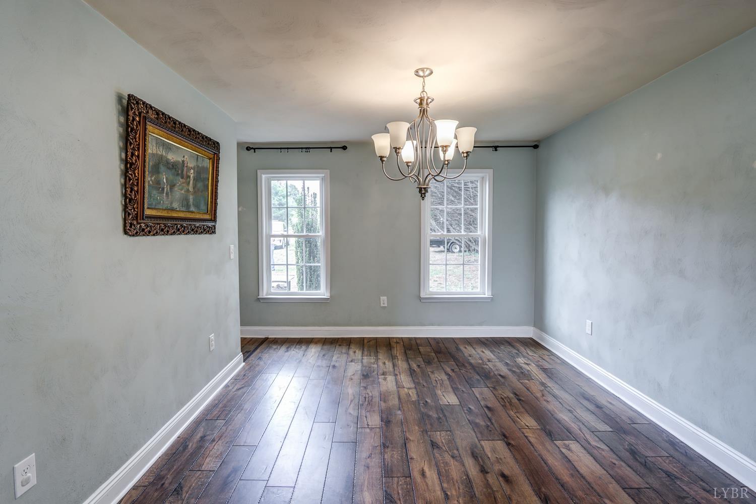 1057 Old Trail Road Forest, VA 24551 - Photo 22 of 49 a view of livingroom with hardwood floor and window
