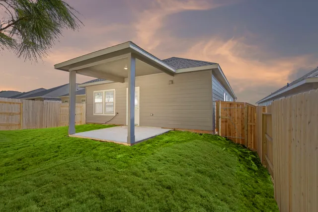 a backyard of a house with lots of green space