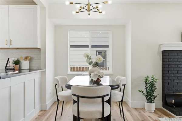 a view of a dining room with furniture window and wooden floor