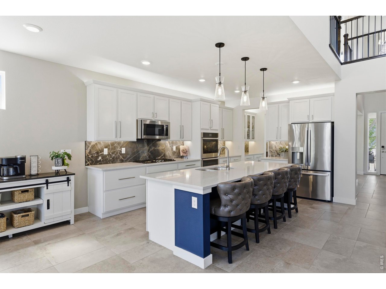 2910 Water View Street Timnath, CO 80547 - Photo 12 of 50 a large kitchen with a table and chairs