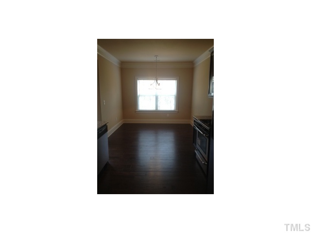 2203 Shepherd Valley Street Raleigh, NC 27610 - Photo 2 of 10 Wide plank hardwoods through-out the kitchen and breakfast room and in the foyer extending to the family room
