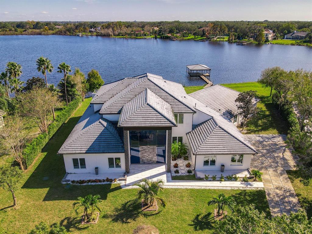 13013 Water Point Boulevard Windermere, FL 34786 - Photo 1 of 1 an aerial view of a house with swimming pool and a yard