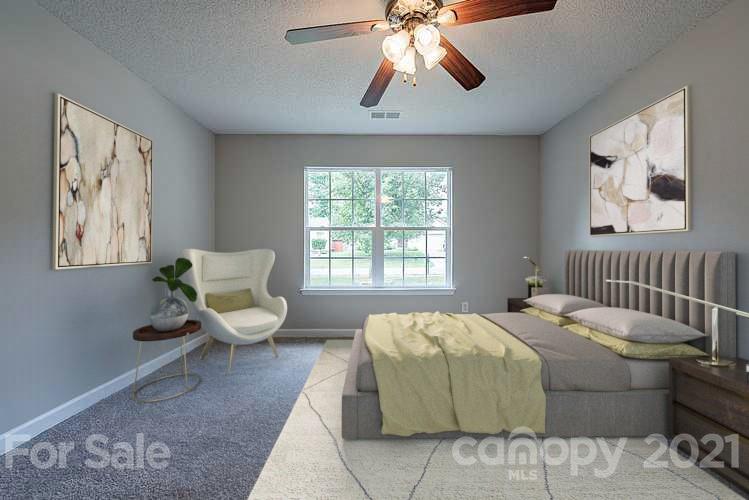1665 Tate Road Rock Hill, SC 29732 - Photo 3 of 16 a bedroom with a bed and glass window