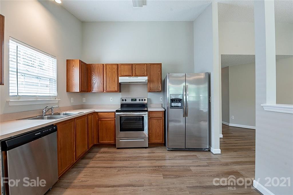 1665 Tate Road Rock Hill, SC 29732 - Photo 4 of 16 a kitchen with stainless steel appliances granite countertop a refrigerator sink and stove