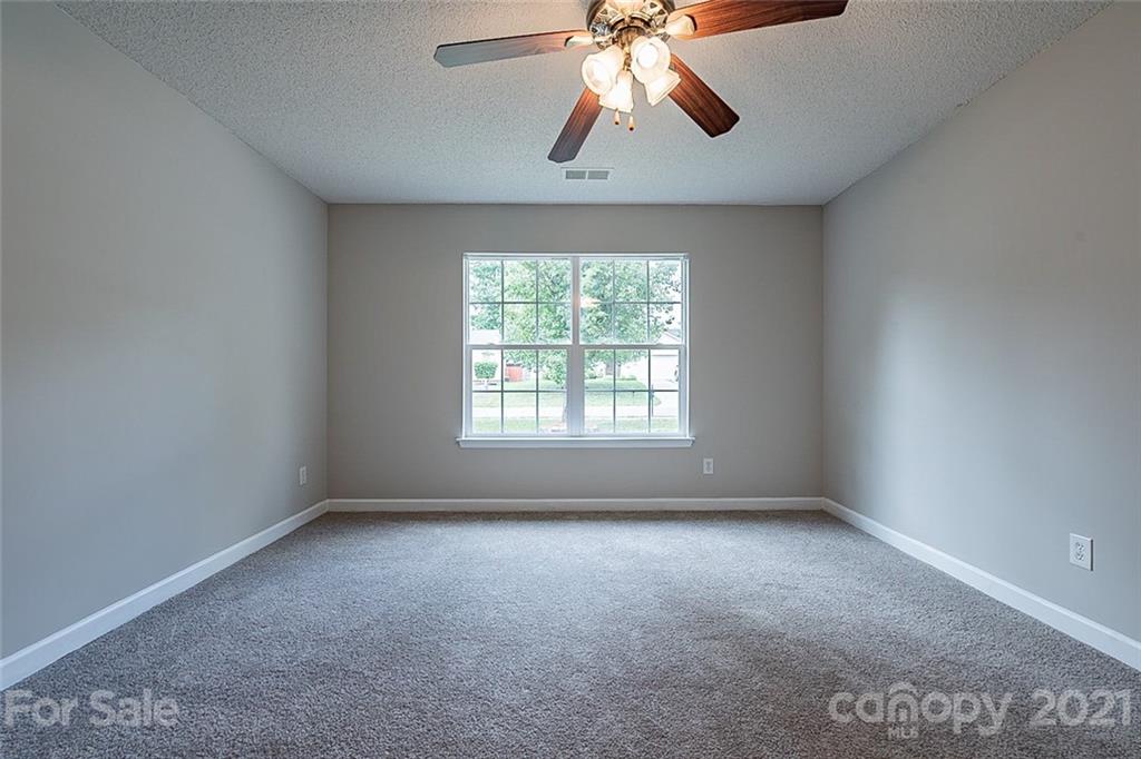 1665 Tate Road Rock Hill, SC 29732 - Photo 10 of 16 an empty room with windows and fan