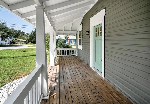 a view of balcony with wooden floor