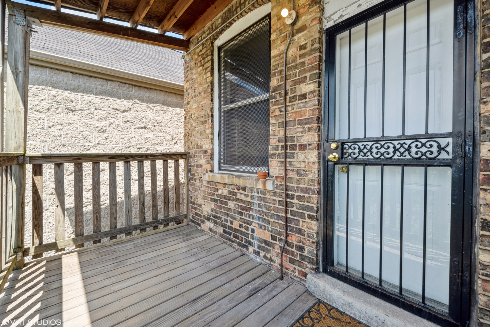 6320 South Drexel Avenue, Unit 3 Chicago, IL 60637 - Photo 12 of 13 a view of a balcony with wooden floor