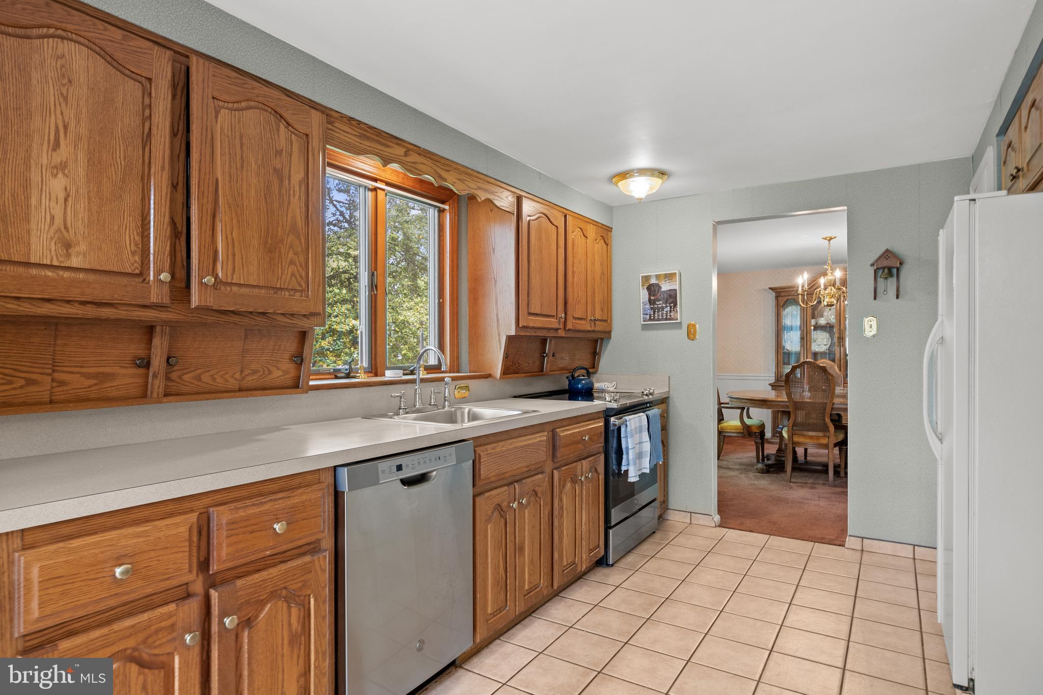 100 Sawmill Road Cherry Hill, NJ 08034 - Photo 11 of 35 a kitchen with a sink window and cabinets