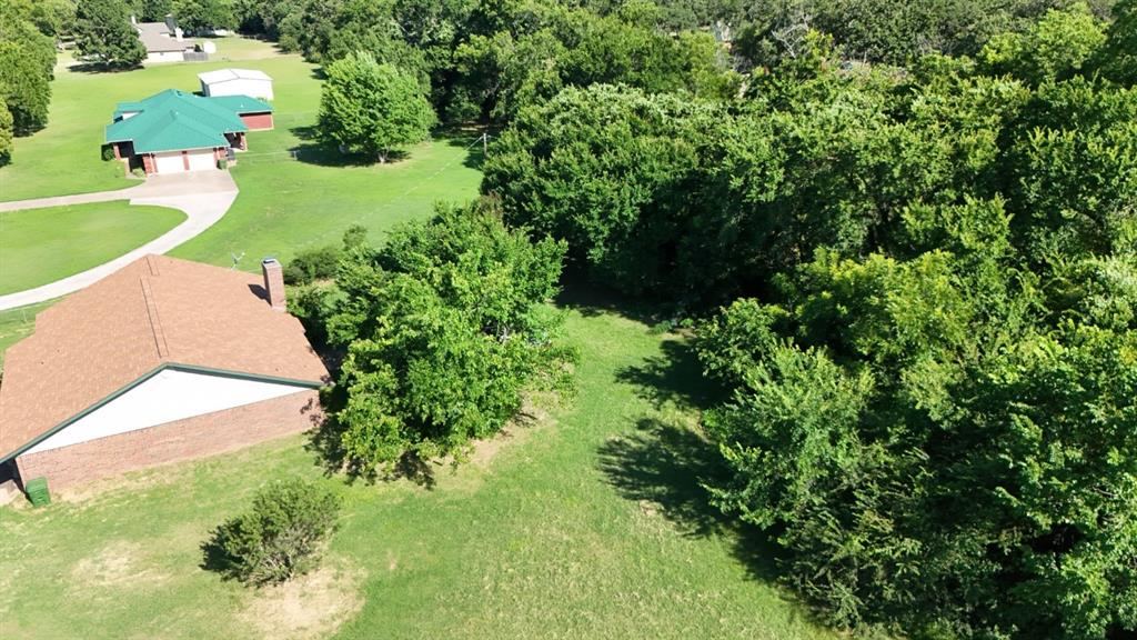 415 Meadowlark Trail Springtown, TX 76082 - Photo 32 of 40 a view of a garden with a swimming pool