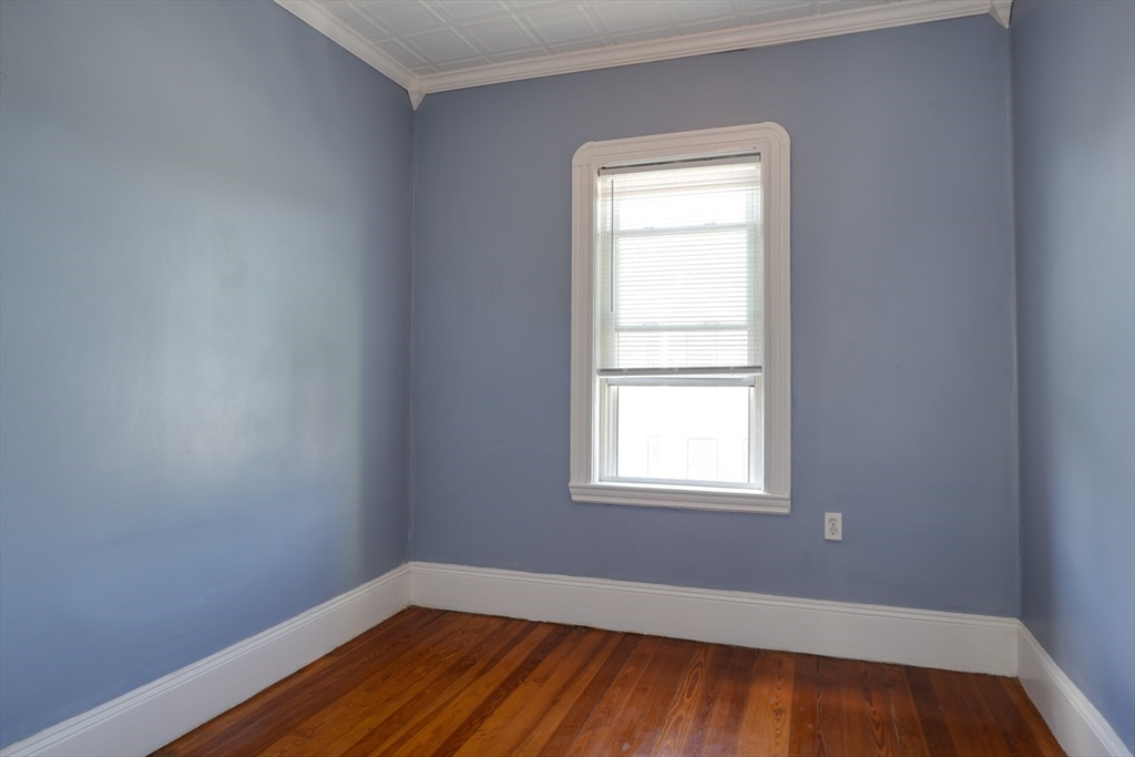 99 Beech Street Belmont, MA 02478 - Photo 11 of 37 an empty room with wooden floor and windows