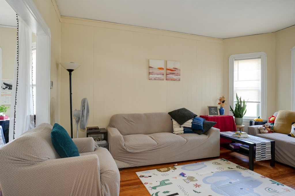 99 Beech Street Belmont, MA 02478 - Photo 17 of 37 a living room with furniture and a couch