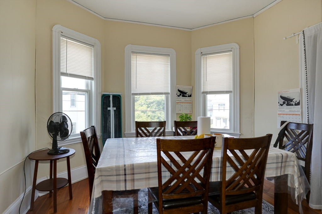 99 Beech Street Belmont, MA 02478 - Photo 18 of 37 a view of a dining room with furniture and windows
