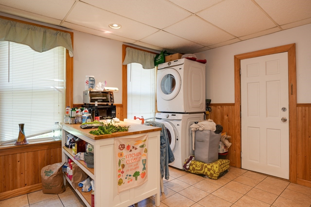 99 Beech Street Belmont, MA 02478 - Photo 23 of 37 a utility room with cabinets dryer and washer