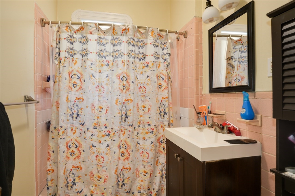 99 Beech Street Belmont, MA 02478 - Photo 31 of 37 a bathroom with a sink and a mirror