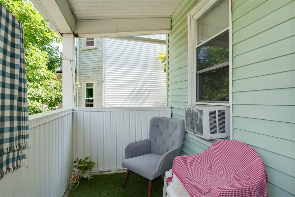 99 Beech Street Belmont, MA 02478 - Photo 32 of 37 a view of a chair and table in the balcony