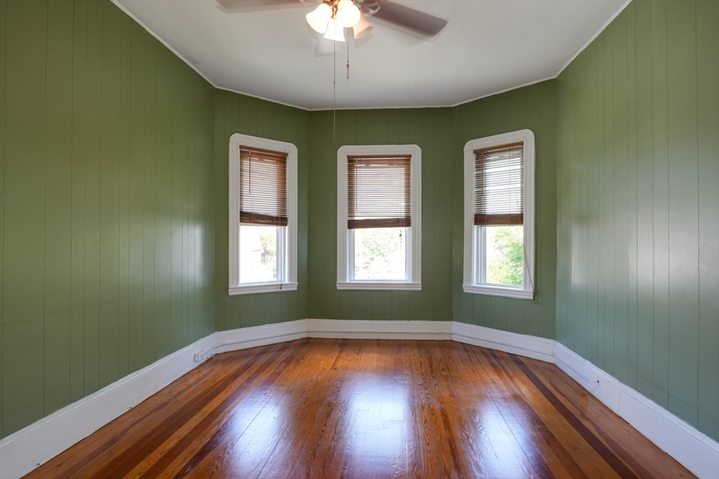 99 Beech Street Belmont, MA 02478 - Photo 7 of 37 a view of empty room with wooden floor and fan
