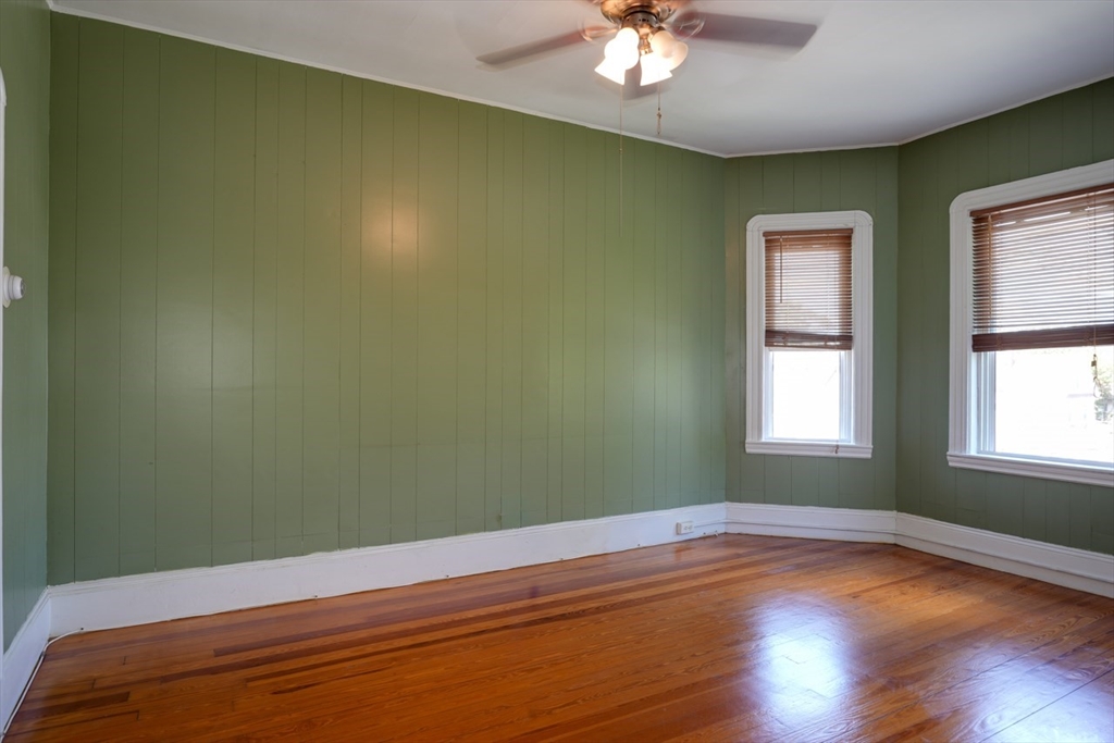 99 Beech Street Belmont, MA 02478 - Photo 8 of 37 a view of empty room with window and wooden floor