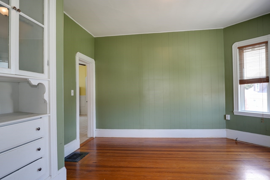 99 Beech Street Belmont, MA 02478 - Photo 9 of 37 a view of a room with wooden floor and cabinet