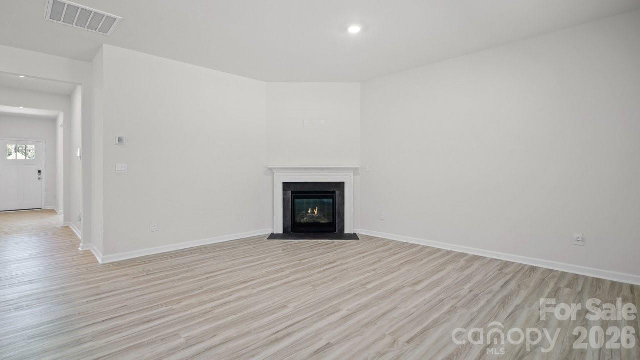 3688 Mercer Street Terrell, NC 28682 - Photo 17 of 34 a view of an empty room with wooden floor and a window