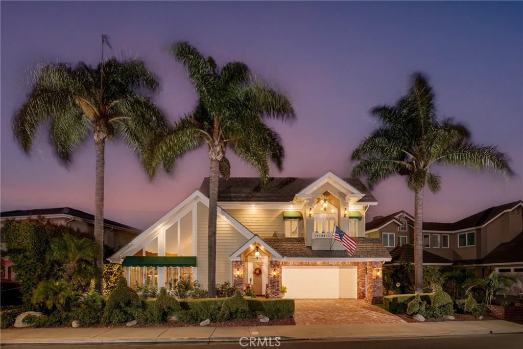 a view of a house with a palm tree