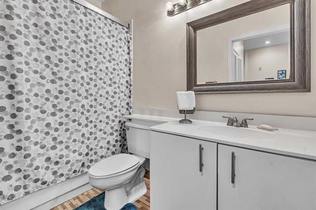 7802 Trent Drive, Unit 406 Fort Lauderdale, FL 33321 - Photo 29 of 70 a bathroom with a granite countertop toilet and a sink