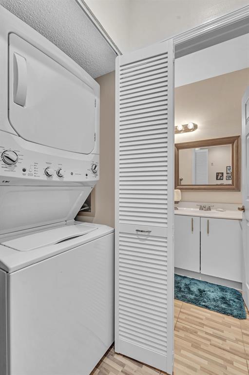 7802 Trent Drive, Unit 406 Fort Lauderdale, FL 33321 - Photo 31 of 70 a utility room with dryer and washer