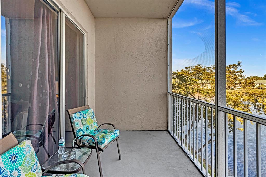 7802 Trent Drive, Unit 406 Fort Lauderdale, FL 33321 - Photo 35 of 70 a view of a balcony with chair and table