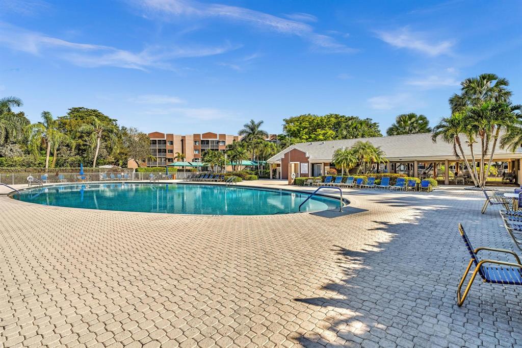 7802 Trent Drive, Unit 406 Fort Lauderdale, FL 33321 - Photo 45 of 70 a view of swimming pool and lake view
