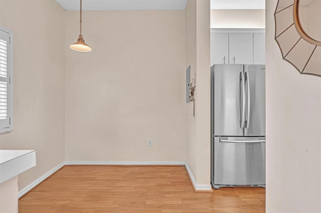 7802 Trent Drive, Unit 406 Fort Lauderdale, FL 33321 - Photo 10 of 70 a view of a room with wooden floor and cabinet