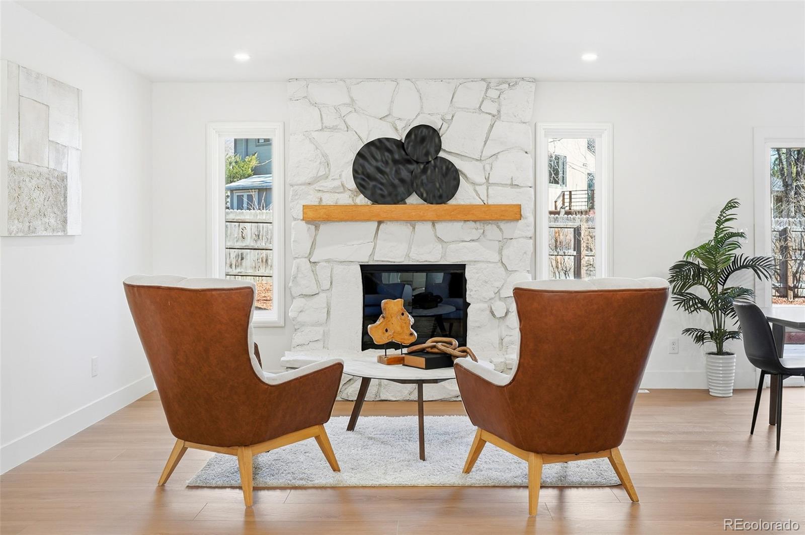 4788 Briar Ridge Trail Boulder, CO 80301 - Photo 11 of 42 a living room with furniture and a fireplace