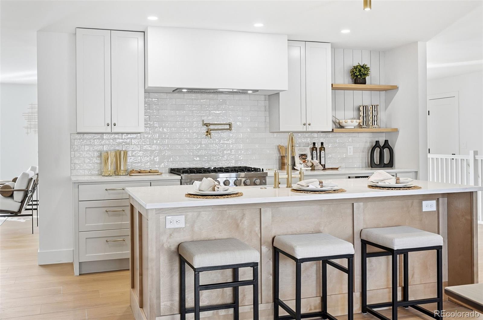 4788 Briar Ridge Trail Boulder, CO 80301 - Photo 14 of 42 a kitchen with stainless steel appliances granite countertop a table chairs sink and cabinets