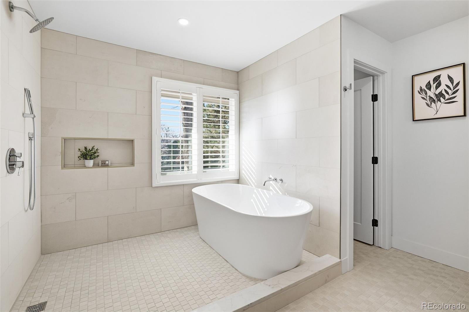 4788 Briar Ridge Trail Boulder, CO 80301 - Photo 21 of 42 a spacious bathroom with a bathtub and next to a window