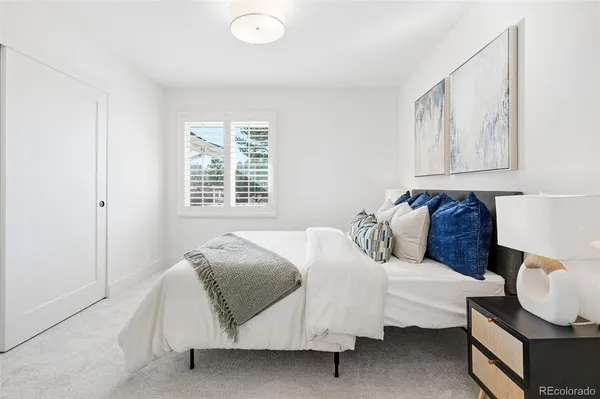 a bedroom with bed and a window
