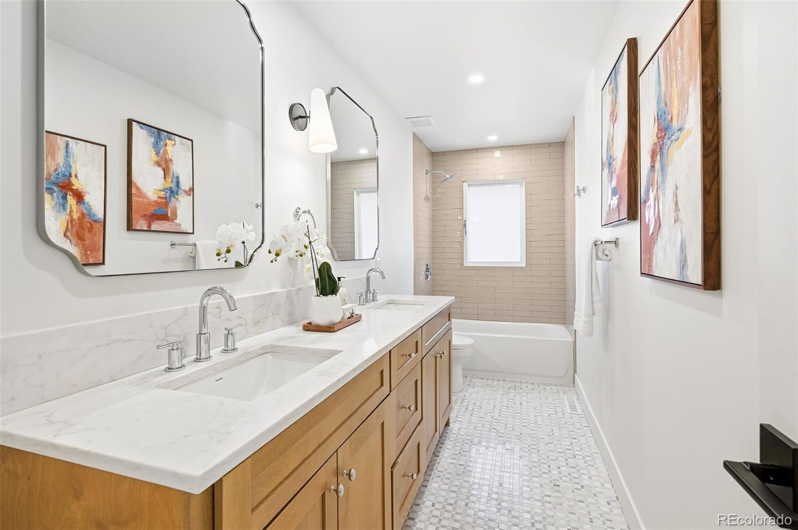 4788 Briar Ridge Trail Boulder, CO 80301 - Photo 24 of 42 a bathroom with a sink a toilet a mirror and shower