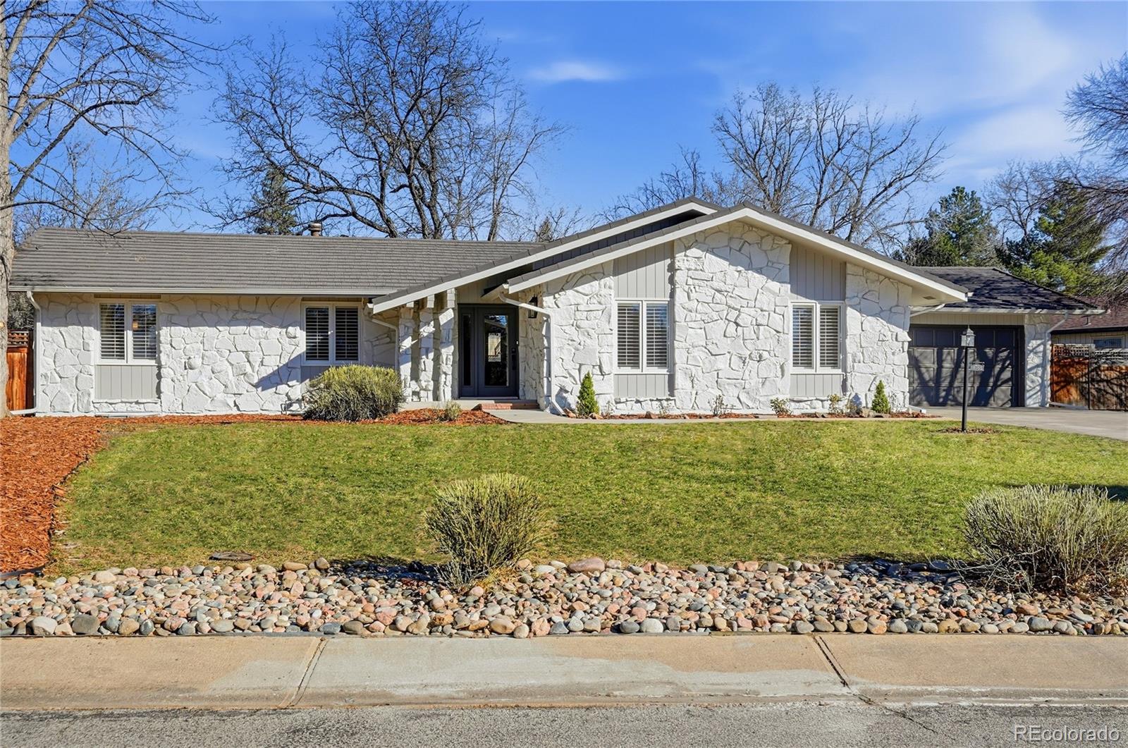 4788 Briar Ridge Trail Boulder, CO 80301 - Photo 3 of 42 a front view of a house with a garden