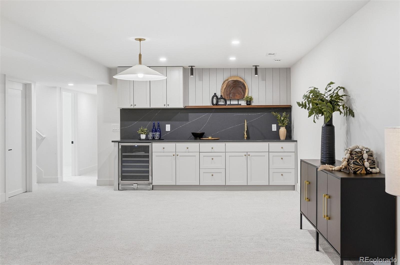 4788 Briar Ridge Trail Boulder, CO 80301 - Photo 31 of 42 a kitchen with granite countertop a sink and cabinets