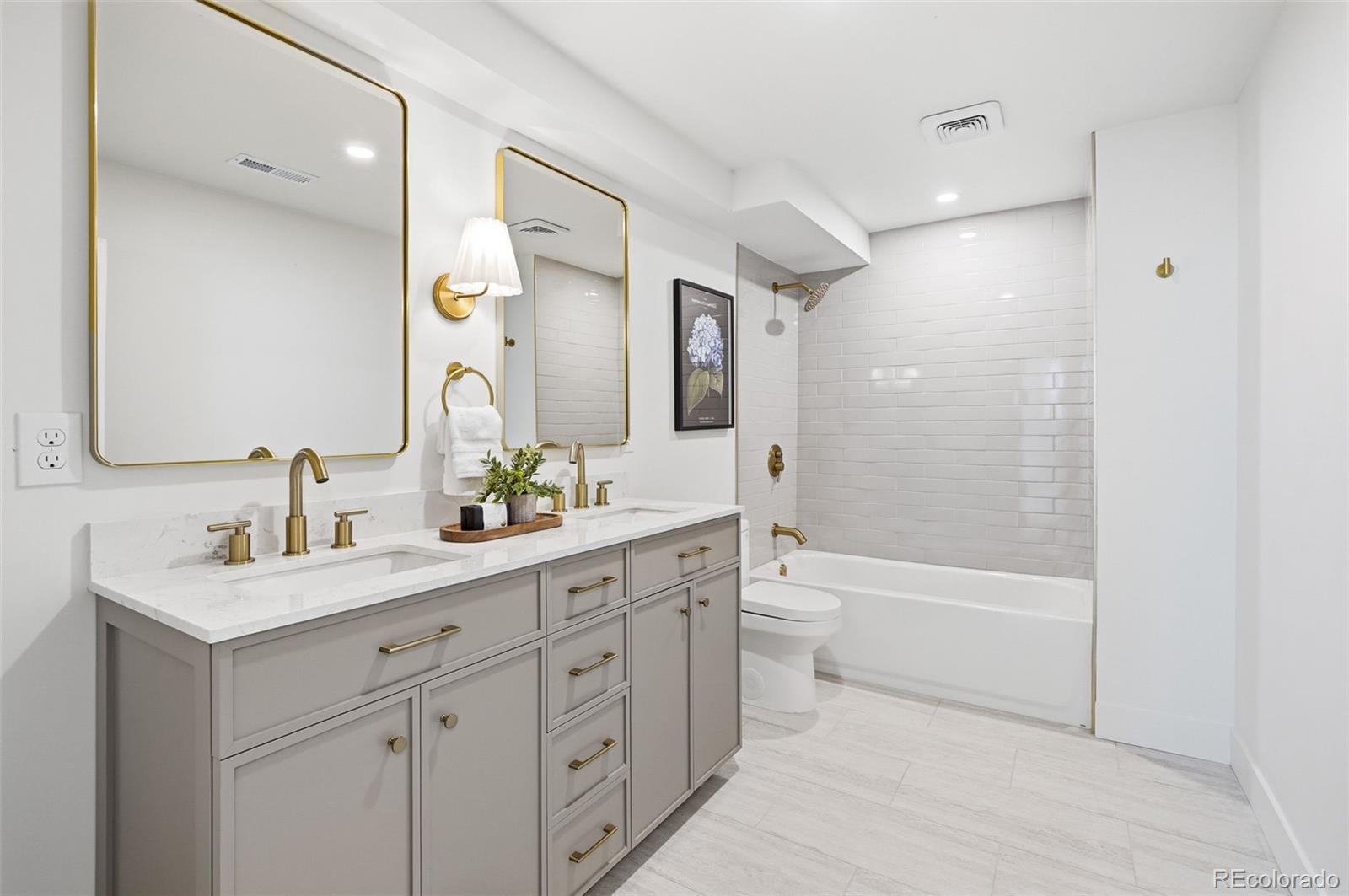 4788 Briar Ridge Trail Boulder, CO 80301 - Photo 34 of 42 a bathroom with a toilet a sink a tub and a mirror