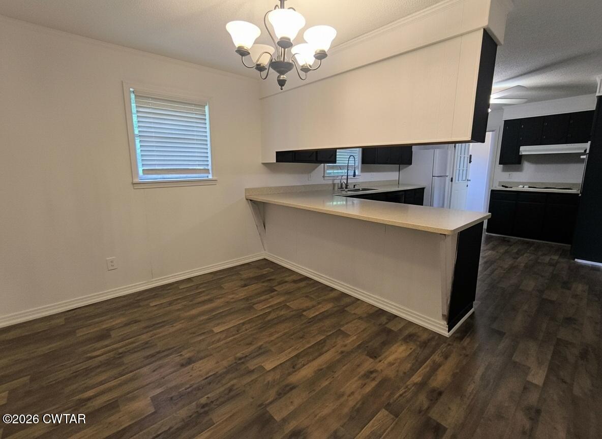 513 Viar Road Dyersburg, TN 38024 - Photo 14 of 37 a view of kitchen with granite countertop cabinets and wooden floor